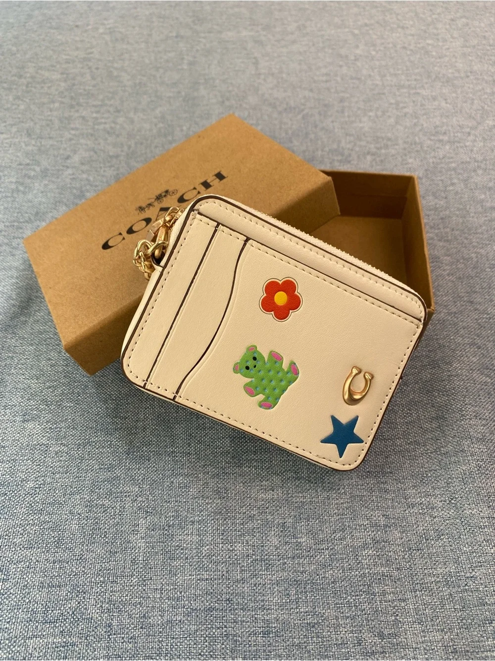 Coach Cream Card Holder with Gold Chain and Playful Charms